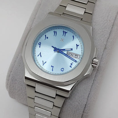 Stainless steel watch with 40mm ice blue dial, blue Arabic numerals, day-date display, and matching blue hands.