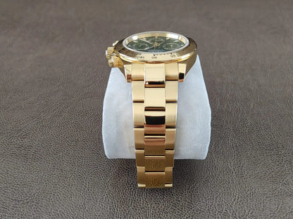 Gold stainless steel bracelet watch with green dial and gold accents, 40mm round case.