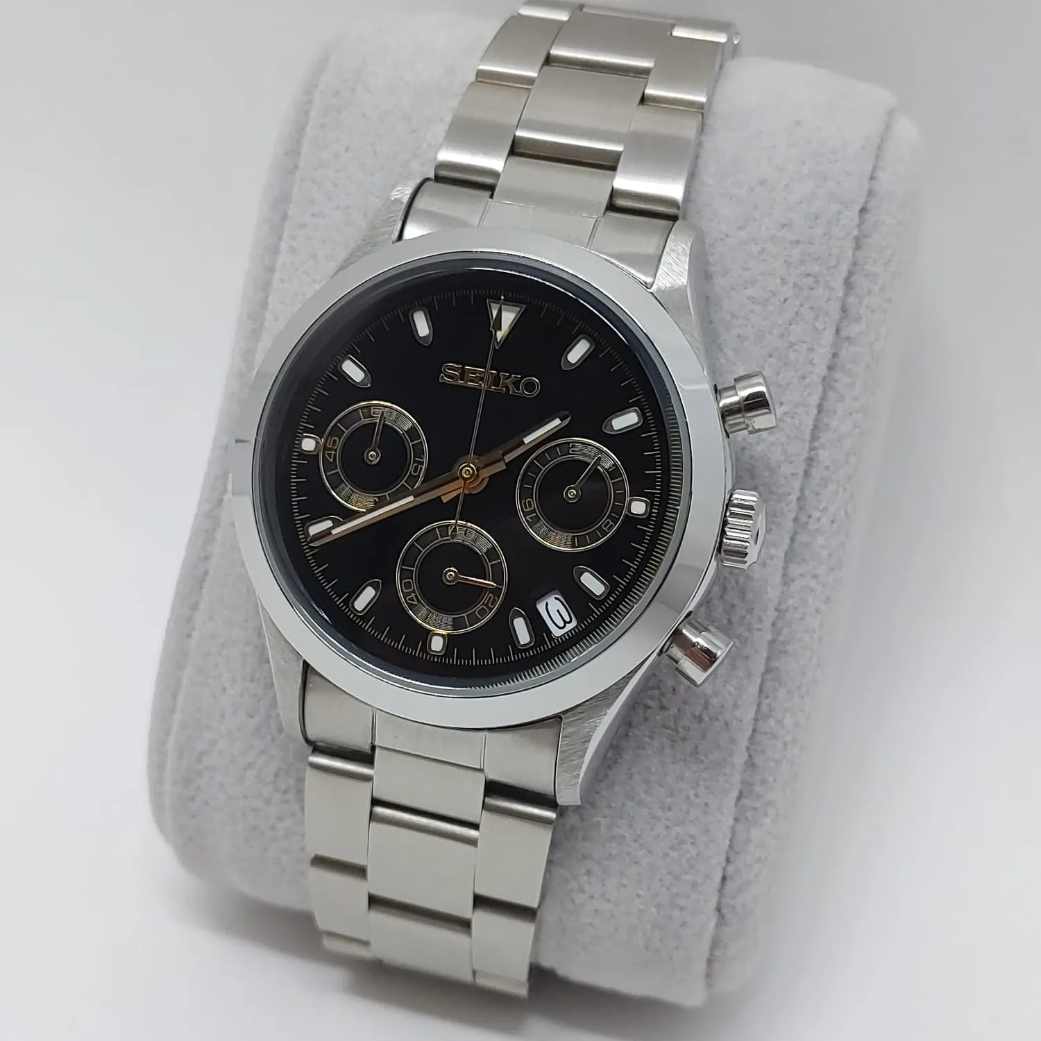Seiko VK63 chronograph watch with black dial, silver subdials, stainless steel case and bracelet.