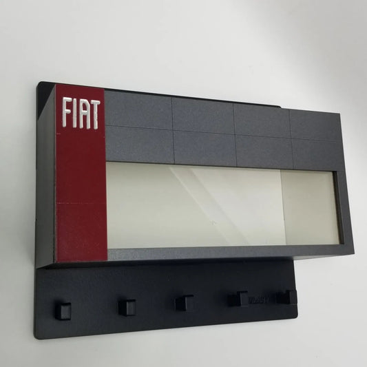 Black wall-mounted key hook rack with five hooks, featuring a gray and red panel with white Fiat logo on left side.
