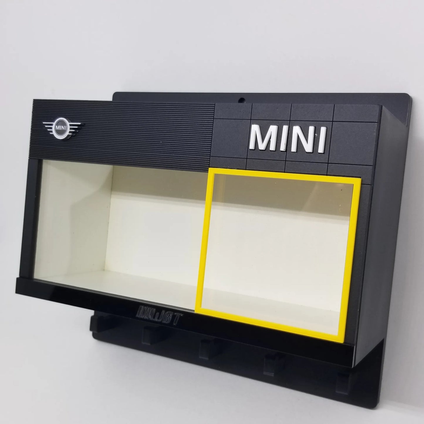 Black Mini wall key hook rack with clear display case and MINI logo on top right.