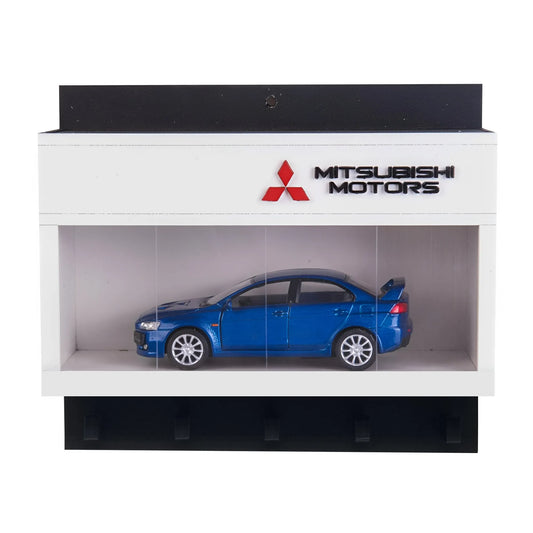 White wall-mounted Mitsubishi key hook rack with red logo and blue scale model car display case.