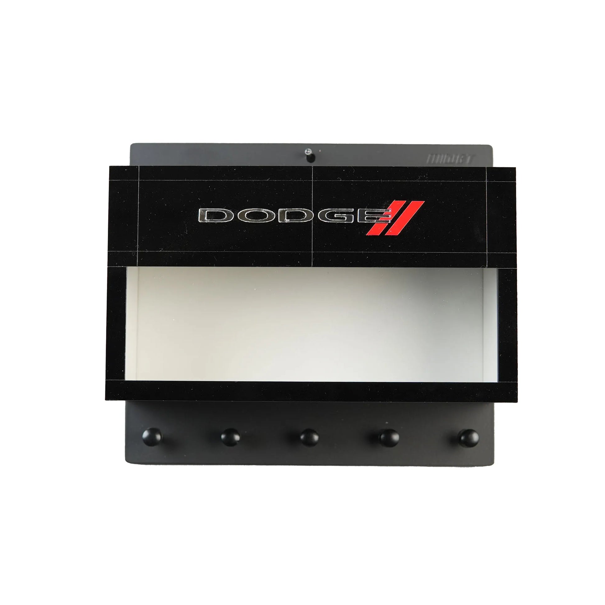Black wall-mounted key hook rack with Dodge logo, five metal hooks, and a recessed display shelf.