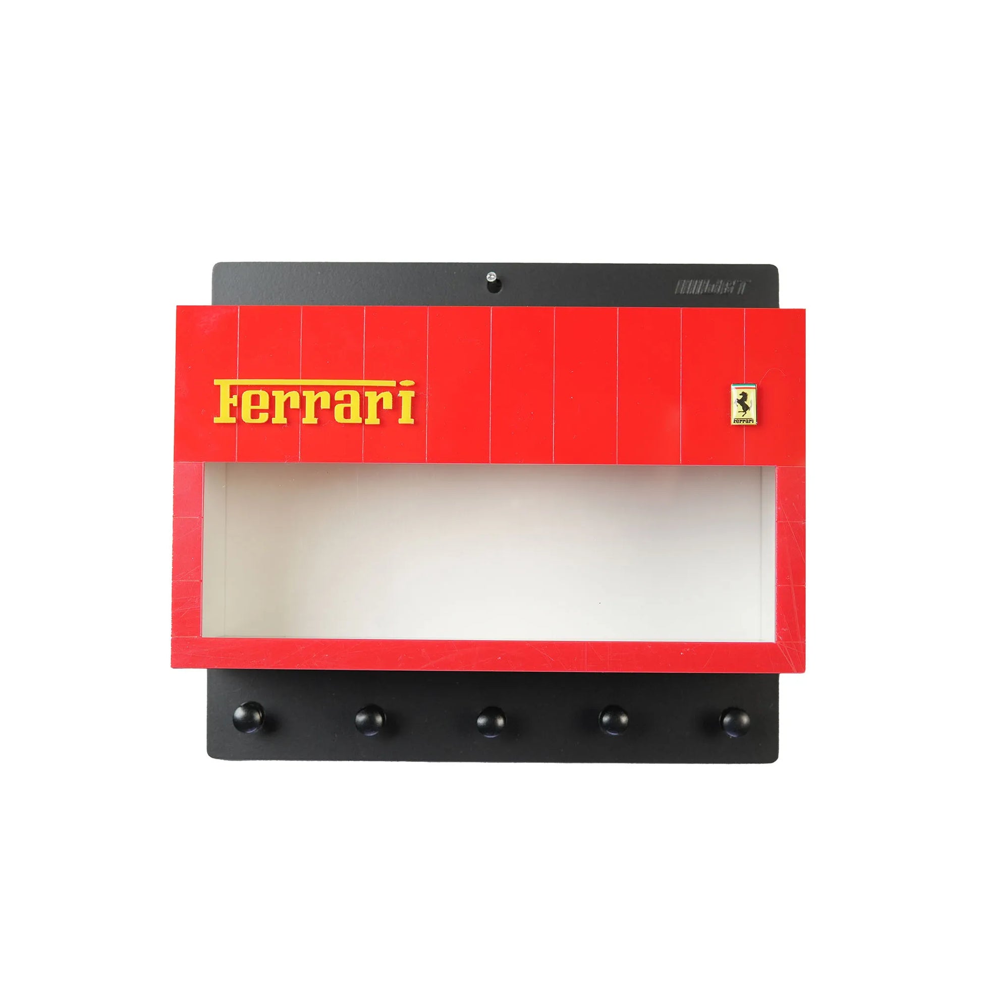 Black and red Ferrari wall-mounted key hook rack with five black hooks and Ferrari logo panel.