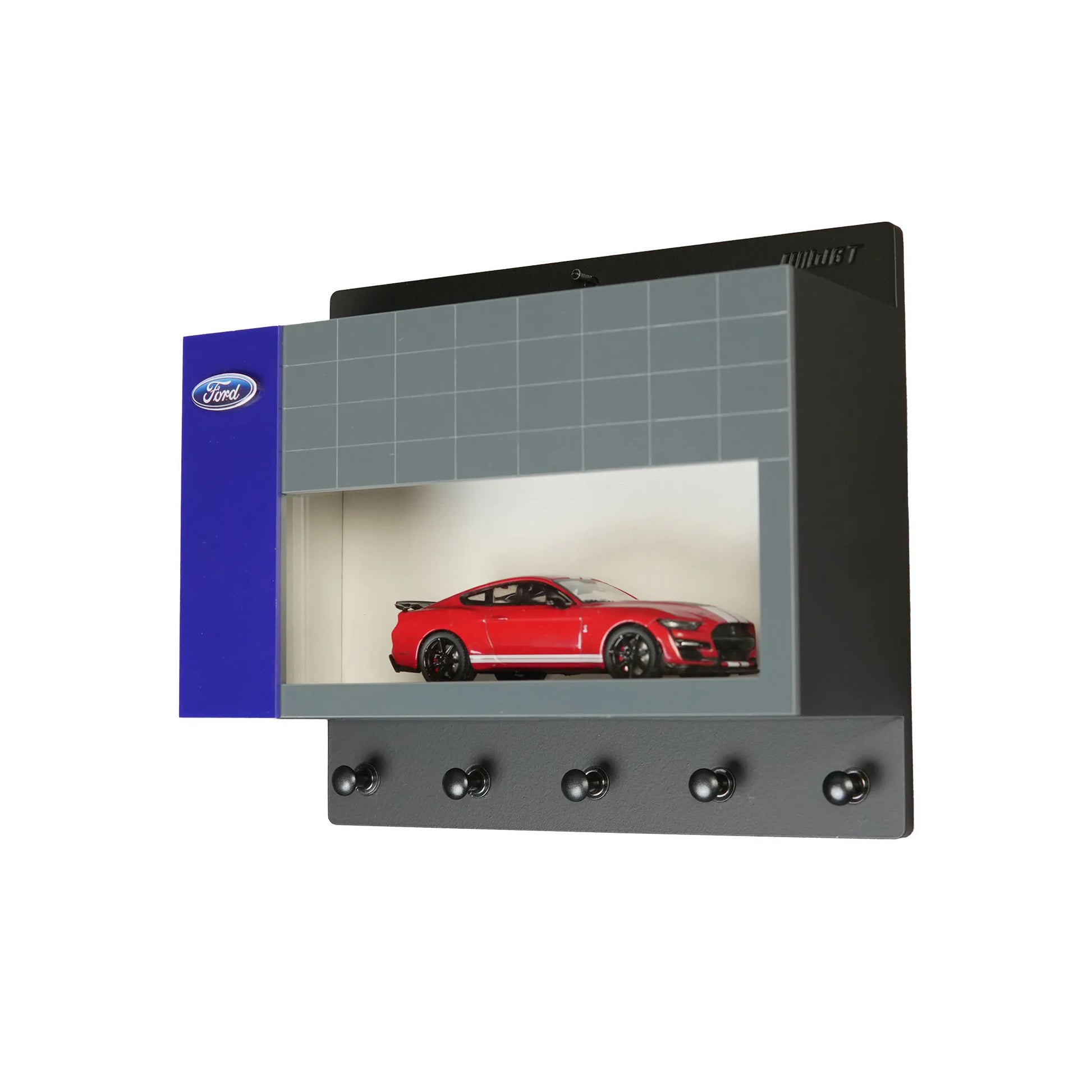 Black wall-mounted key hook rack with display case featuring red Ford model car and five hooks.