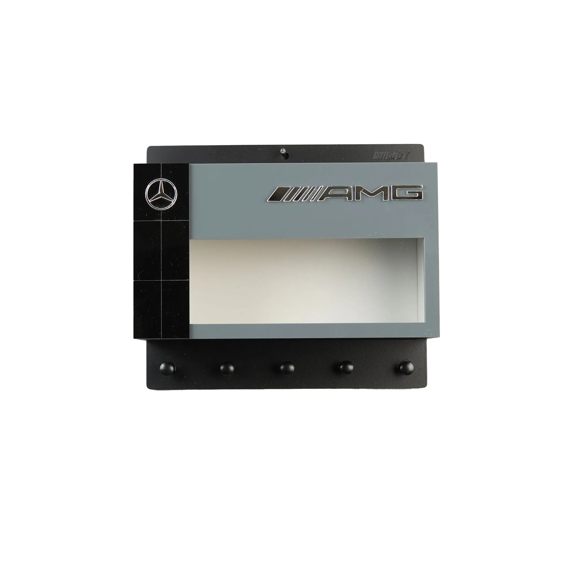 Black and gray Mercedes AMG wall key hook rack with four hooks and branded logos.