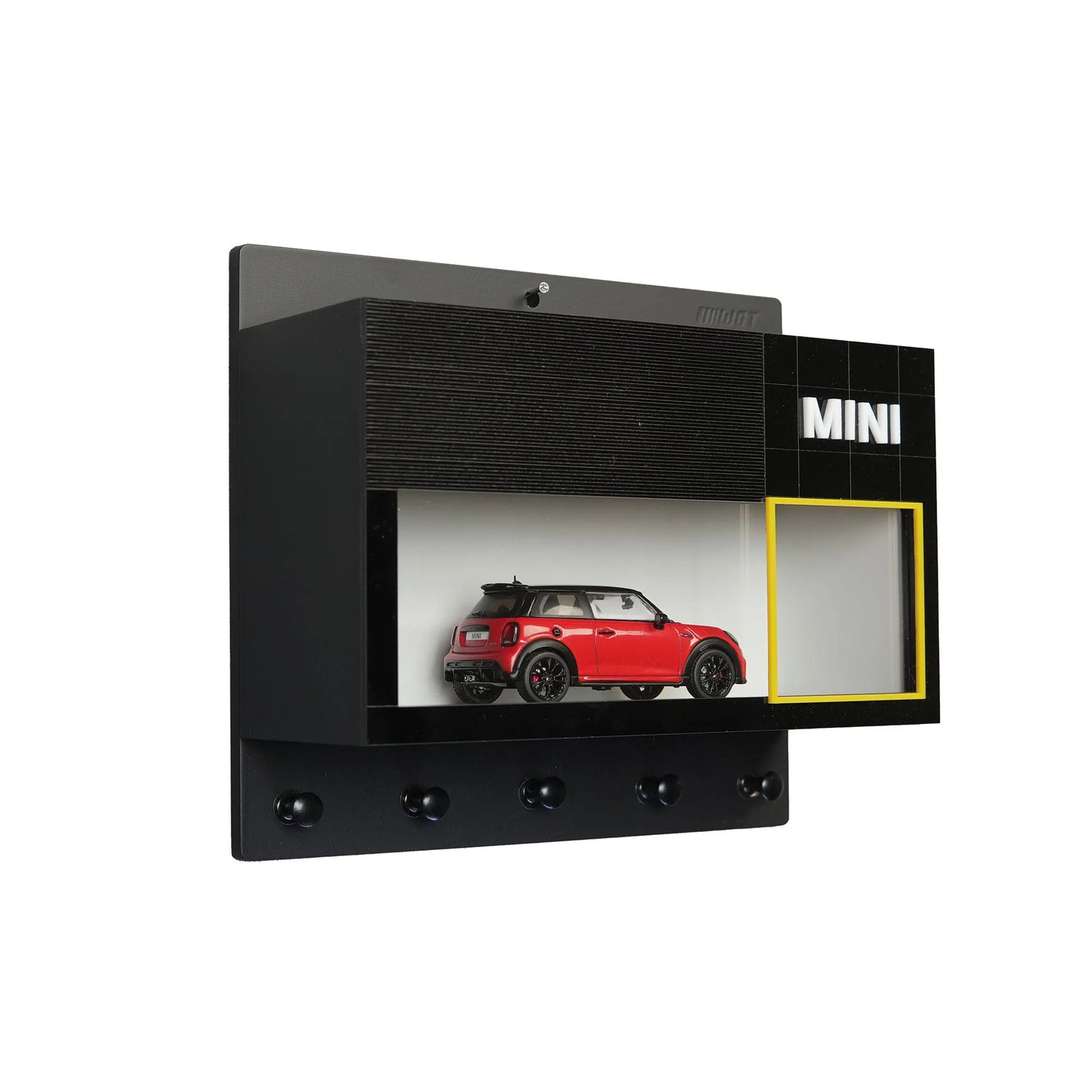 Black wooden wall key hook rack with a red scale model car and a clear display case labeled MINI.