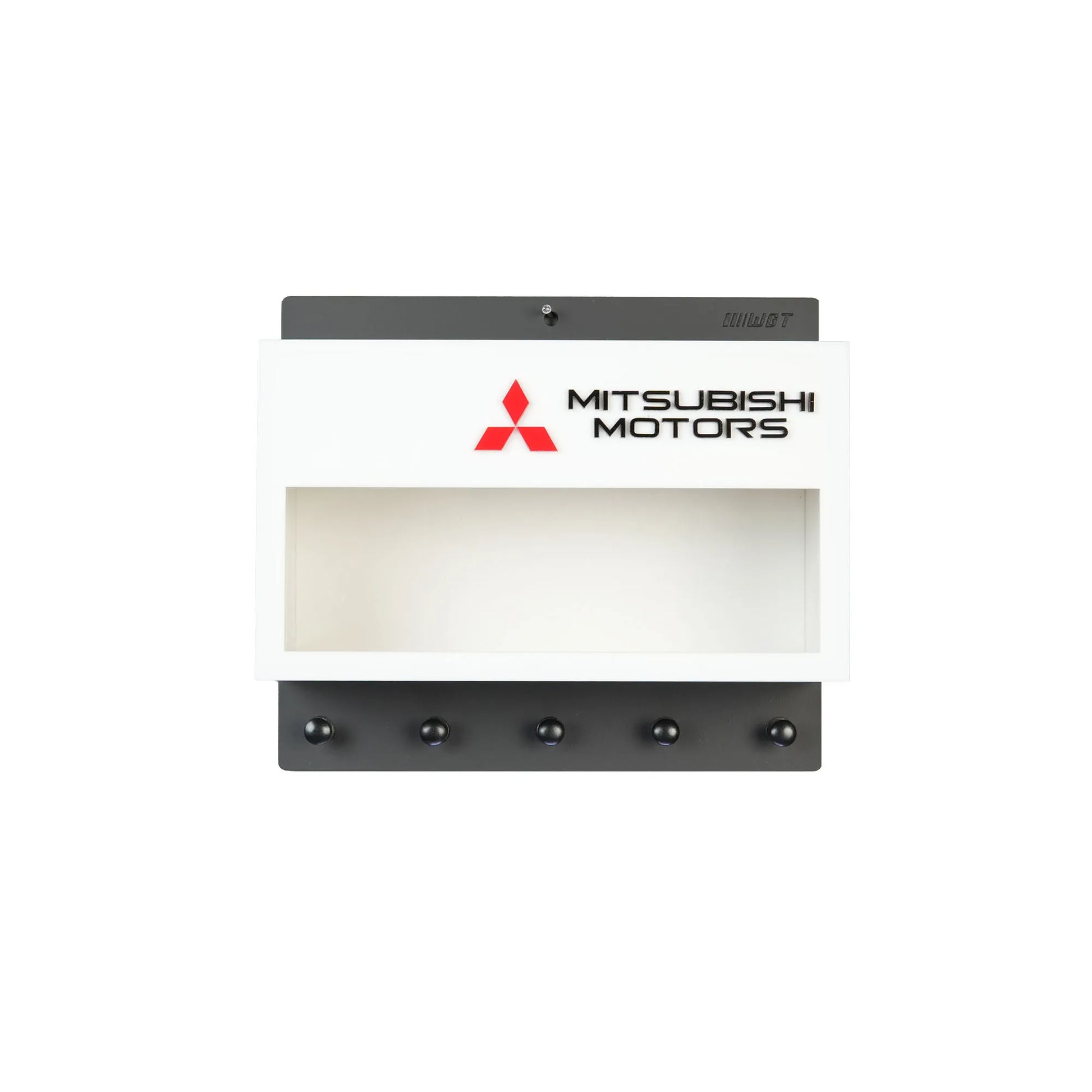White and black Mitsubishi Motors wall key hook rack with five black hooks and open display shelf.