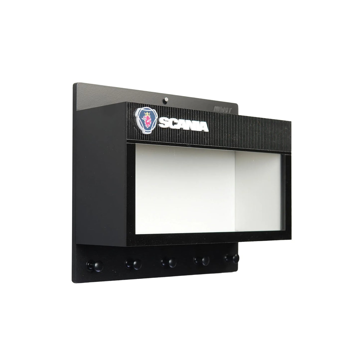 Black wall-mounted key hook rack with Scania logo and transparent display case window.