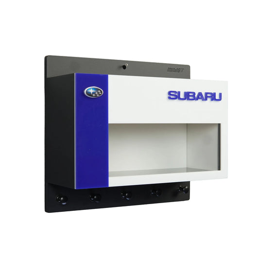 Wall-mounted Subaru key hook rack and scale model car display case in blue, white, and black with five hooks and Subaru logo.